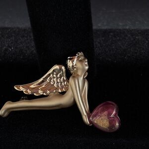 AJC Angel brooch holding purple heart  muted and shiny gold tone finish wings